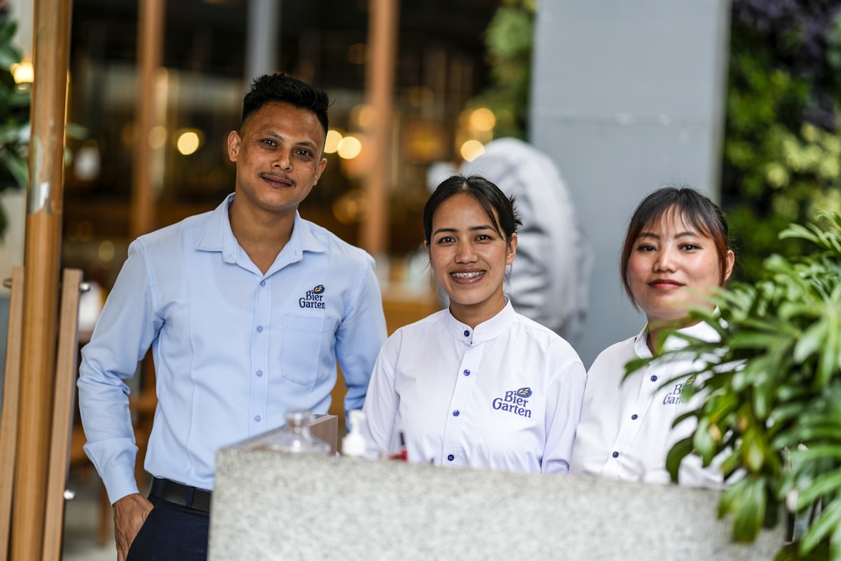 Hospitality staff in branded uniforms from SUQ MEDIA